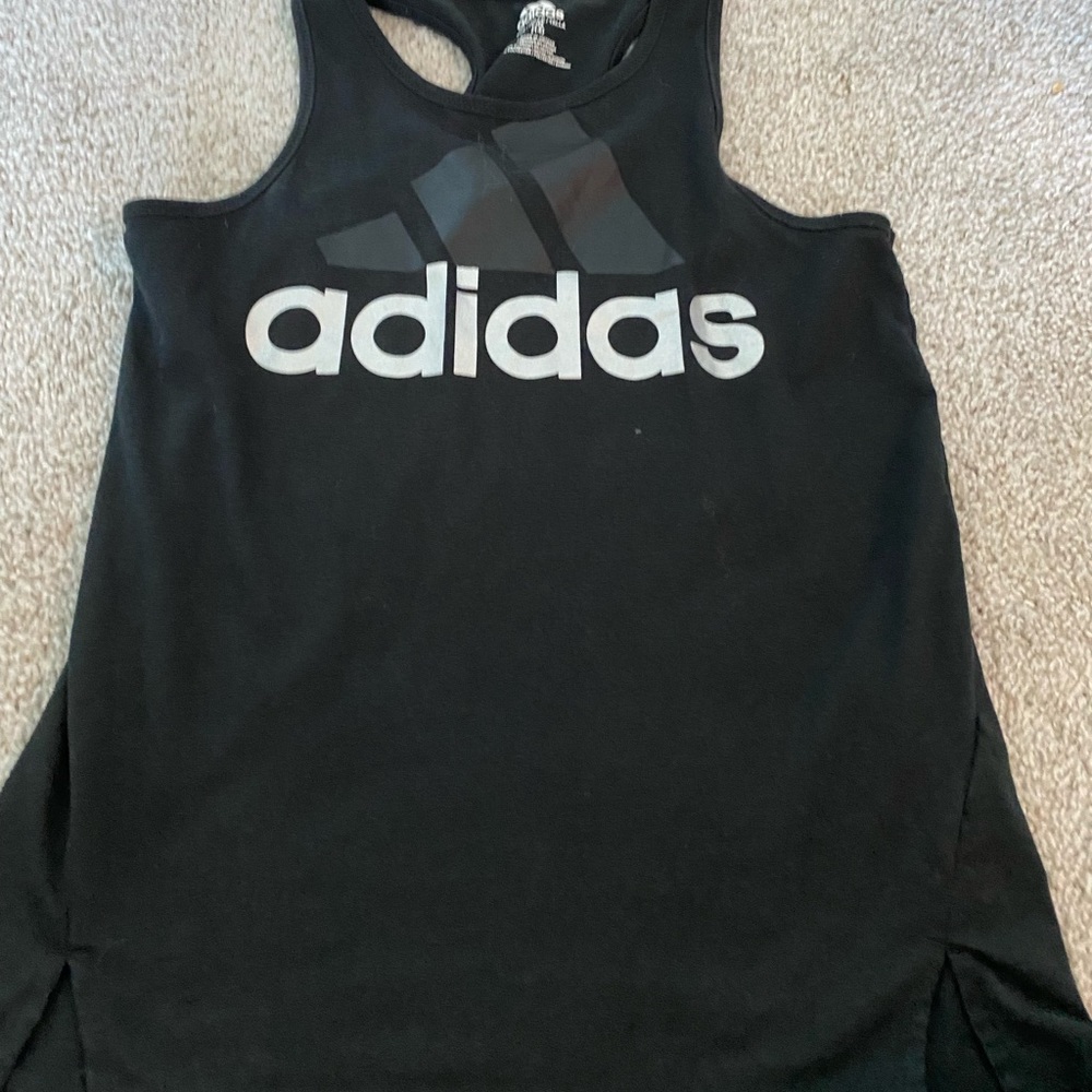 This is an Adidas athletic tank top. Size Youth large.